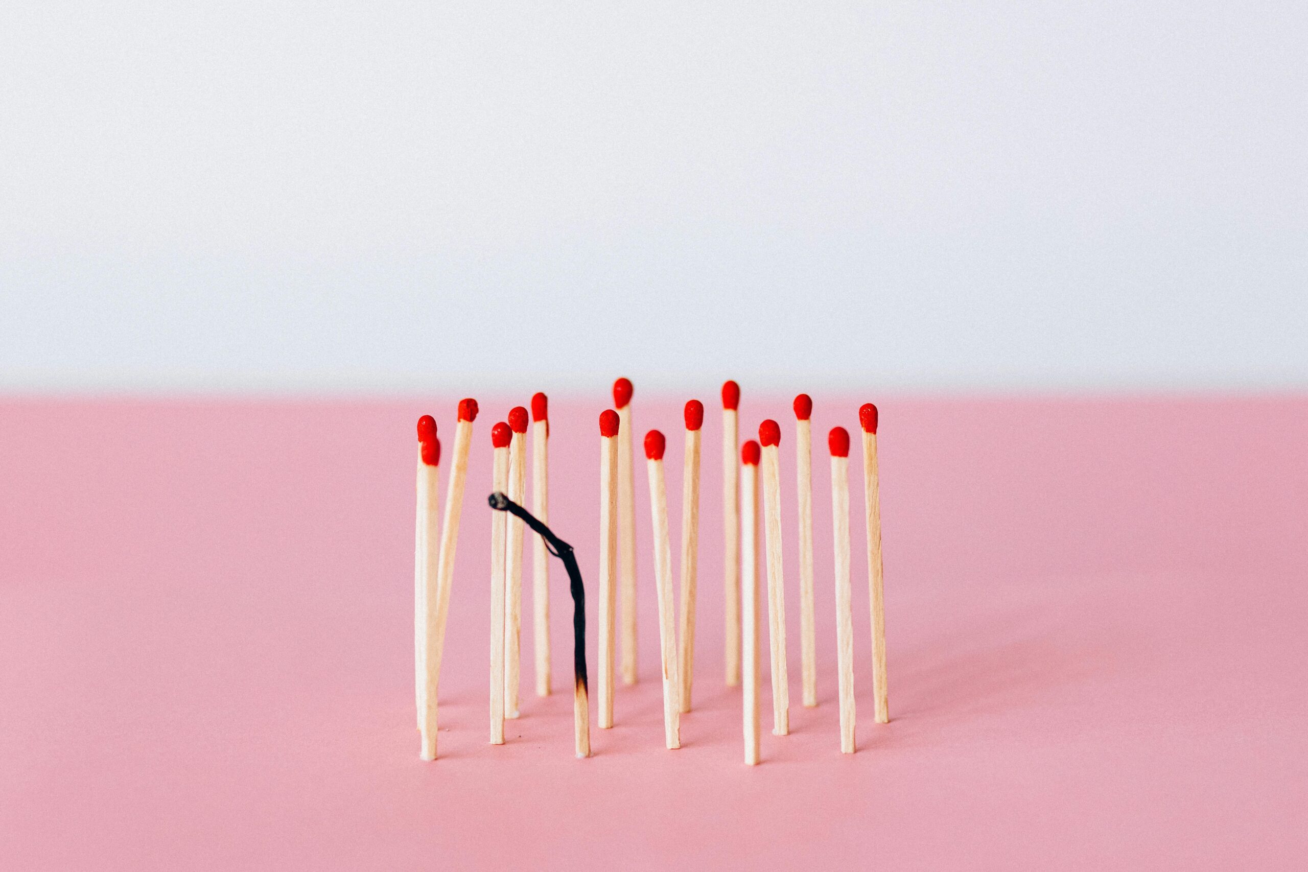 Photo by Nataliya Vaitkevich: https://www.pexels.com/photo/matchsticks-on-pink-surface-6837623/